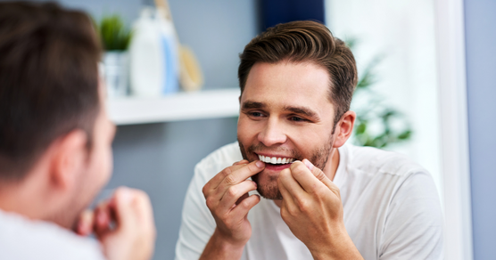 man flossing food catching